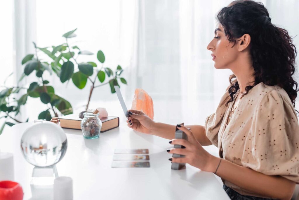 side view of gypsy fortune teller holding tarot ca 2023 11 27 05 32 33 utc